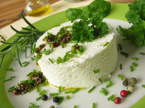 Goat's cream cheese with herb marinade and pepper