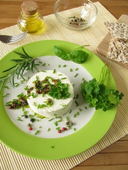 Goat's cream cheese with herb marinade and pepper