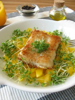Fish on peppers and cress
