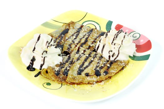 chocolate pancake with hazel nuts and whipped creame