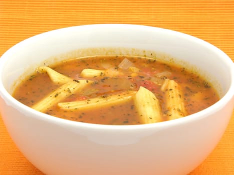 Noodle soup with tomatoes and herbs