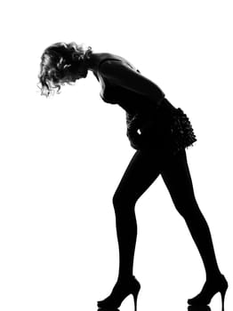 stylish silhouette caucasian beautiful woman sexy  attitude adusting mini skirt behavior clothes full length on studio isolated white background