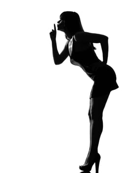 stylish silhouette caucasian beautiful woman hushing silence full length on studio isolated white background