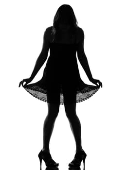 stylish silhouette caucasian beautiful woman showing her legs  full length on studio isolated white background
