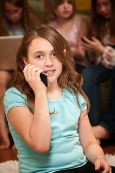 Young Caucasian girl talking on a cellphone