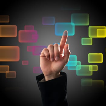 Finger pressing a button on touch screen interface