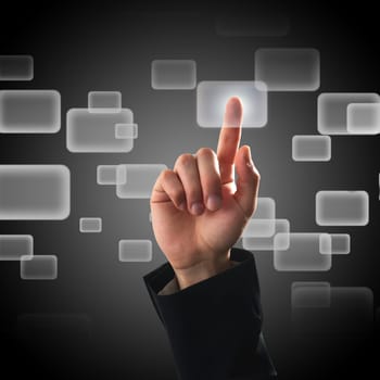 Finger pressing a button on touch screen interface
