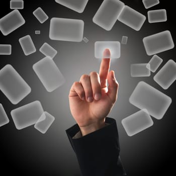 Finger pressing a button on touch screen interface