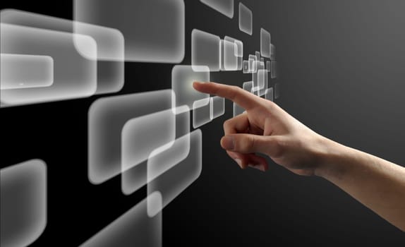 Finger pushing a virtual button on a touch screen interface