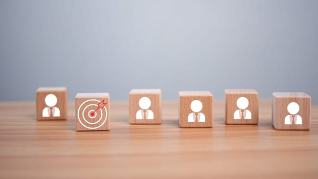 wooden block which prints a target icon and business symbol on white background. Business goals and objectives concept. business competition. business target concept.