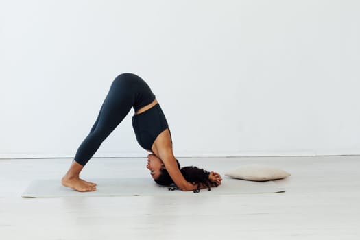 woman doing exercises yoga asana pose workout in the studio