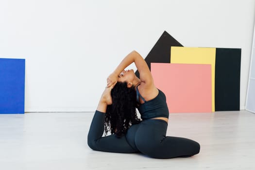 Savasana woman doing exercises yoga asana lotus pose workout in the studio