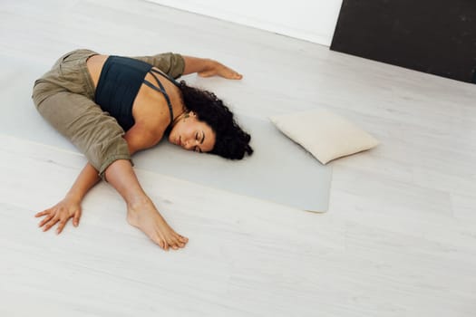 yoga asana shavasana woman doing exercises lotus pose workout in studio