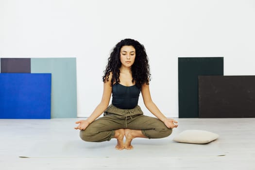 lotus pose training in the studio woman doing yoga exercises asana shavasana
