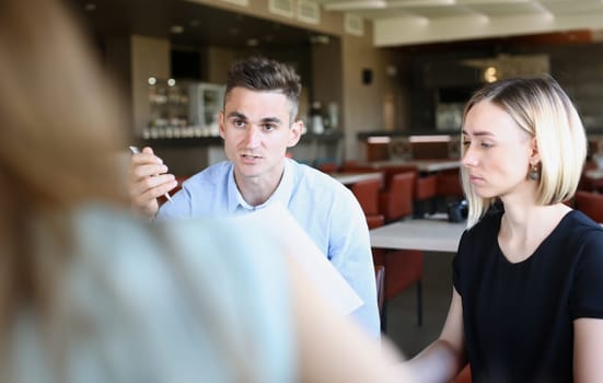 Businessman explains the policy of enterprise discuss the problem of education the study. Stated material a lecture for a narrow circle of people.
