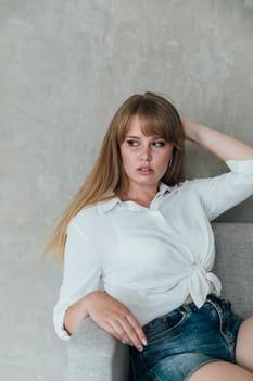 woman sitting on couch in room