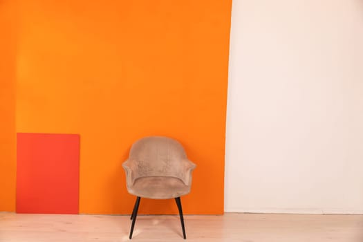 armchair on an orange background, interior, furniture,