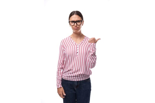 young successful woman with black hair wears a red and white striped blouse.