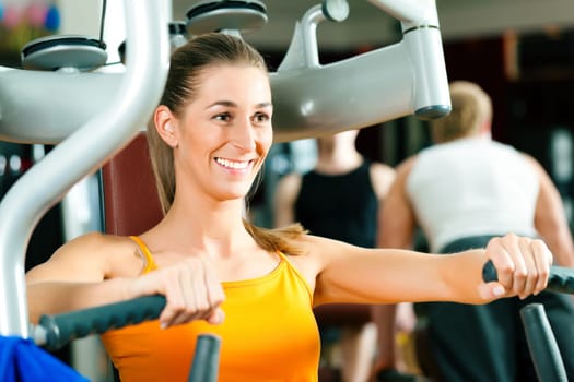 Woman exercising in gym
