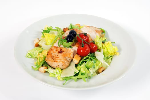 Caesar salad with chicken steak on white background
