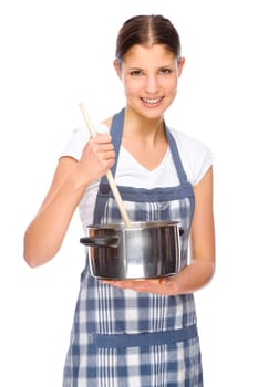 Studio shot of a young woman with a chef's apron