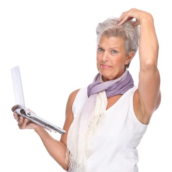 Studio shot of an active senior woman using a notebook