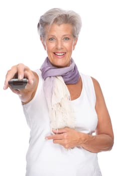Studio shot of an active senior woman with remote control