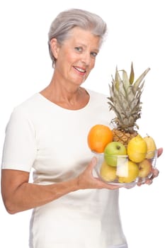Studio shot of an active senior woman with fruit