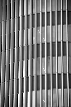Glass facade of a modern office building. Black and white.