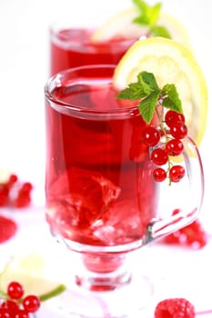 Refreshing summer ice tea or lemonade with fresh fruits
