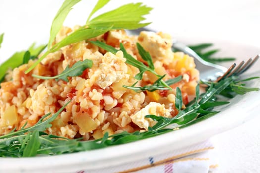 Bulgur risotto with arugula salad
