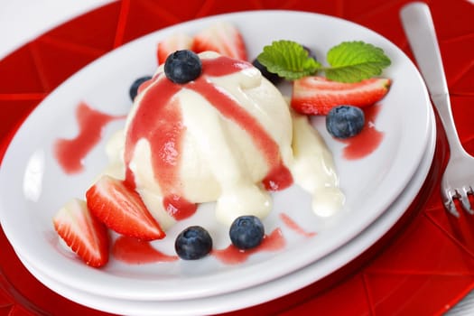 Sweet dumplings filled with fruits and strawberry sauce