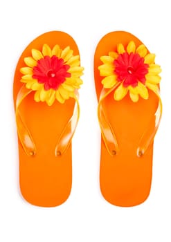 orange flip-flops with flowers on a white background