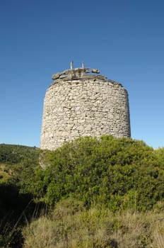 Old stone windmill ruins in Zakynthos, Greece.