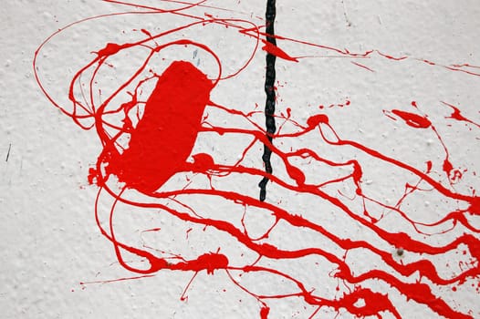 Wall stained with red paint. Abstract texture.