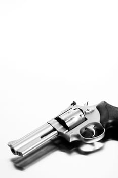 gun on brushed steel surface - modern revolver