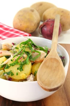 Wild garlic and potato salad with smoked fish