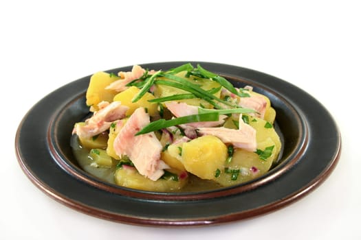 Wild garlic and potato salad with smoked fish
