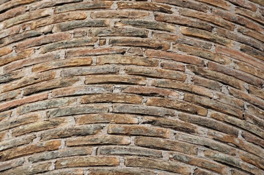 Detail of weathered factory brick chimney. Background texture.