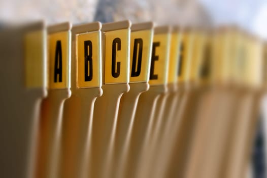 Alphabetical filing tray index office documents organizer. Selective focus.