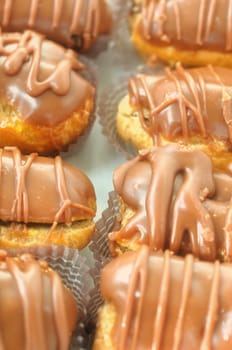 Eclair dessert covered with chocolate icing. Selective focus.