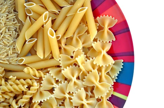 Colorful plate with pasta variety. Creative food on white background.