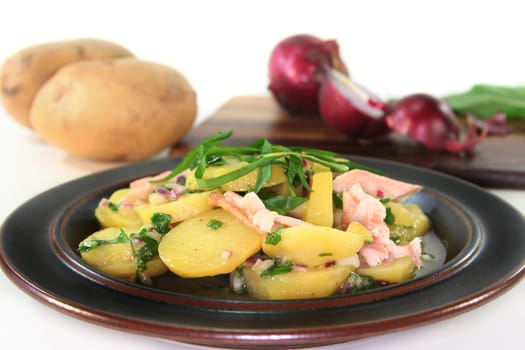 Wild garlic and potato salad with smoked fish