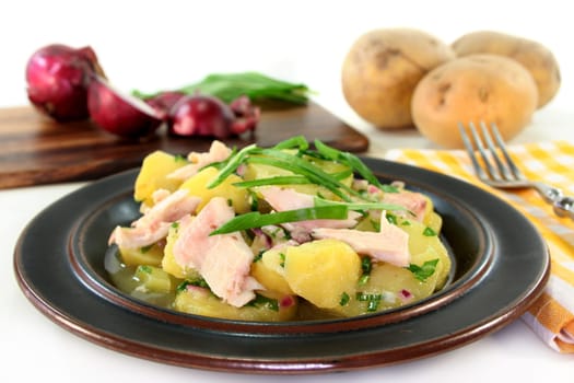 Wild garlic and potato salad with smoked fish