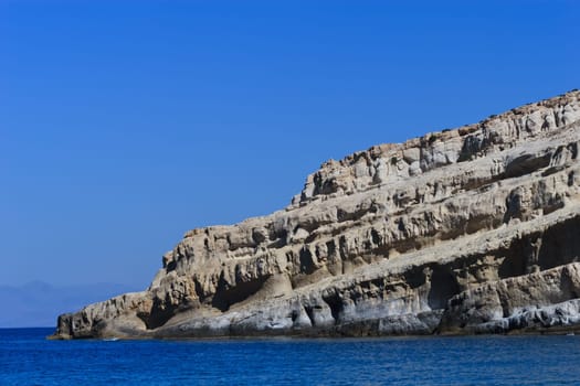 a mountain slope into the sea near the beach Matala