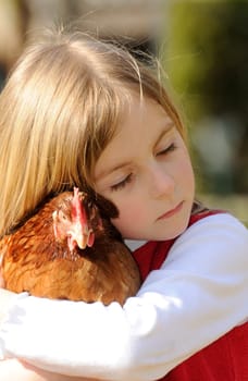 Little girl with chicken