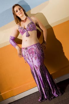 oriental style young beautiful woman with a violet dress