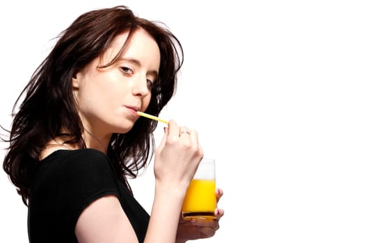 Young pretty woman drinking orange juice with a straw