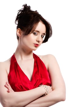 Portrait of a young pretty woman in a red evening dress