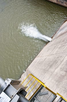 image of  a dam generating electricity with rushing water